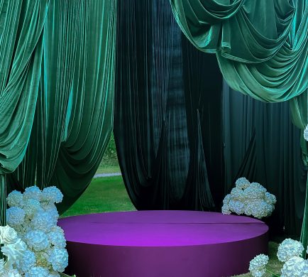 Round stage at an outdoor setting with custom fabric, Eggplant color.