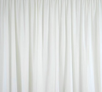 Luxurious white velvet draping for elegant event backdrops and wedding decor