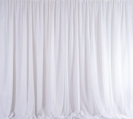 Delicate white sheer draping for elegant wedding and event decoration backdrops