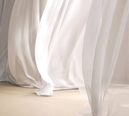 Soothing, mesmerizing wavy harmony movement of layer of blowing white, beige silky smooth sheer fabric cloth curtain in soft beautiful light on beige brown floor stage.