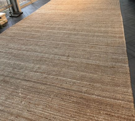 Organic Natural Rug set up at a venue in a diagonal view
