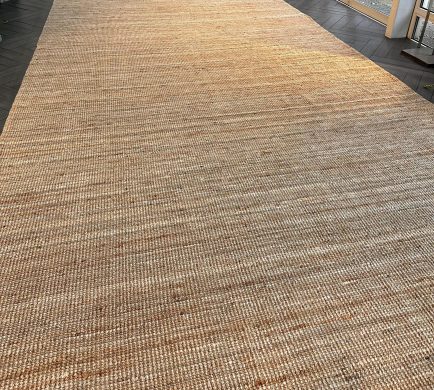 Organic Natural Rug set up at a venue in a diagonal view